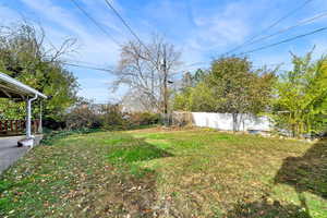 View of yard with a wooden deck