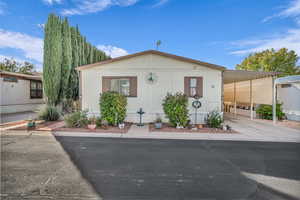 Manufactured / mobile home featuring a carport