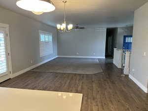 Spare room with ceiling fan and dark hardwood / wood-style flooring