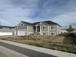 View of front of property with a garage