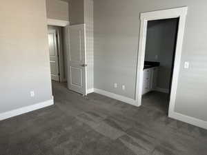 Empty room with dark carpet