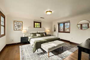 Bedroom featuring dark wood-type flooring