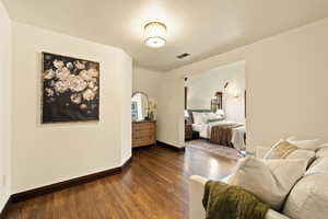 Bedroom featuring dark hardwood / wood-style flooring