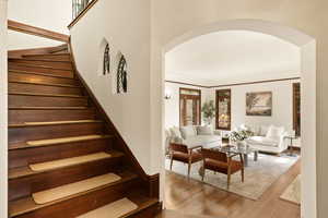 Staircase with hardwood / wood-style floors