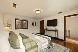 Bedroom featuring dark wood-type flooring