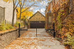 View of gate with a garage