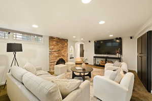 Living room featuring carpet flooring and a fireplace