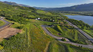 View of property location featuring a water and mountain view