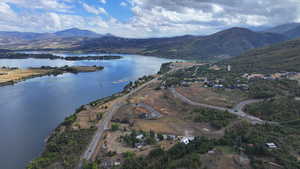 Aerial view featuring a water and mountain view