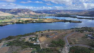 Aerial view featuring a water and mountain view