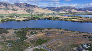 Bird's eye view with a water and mountain view