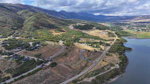 Drone / aerial view with a water and mountain view