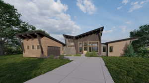 View of front facade featuring a garage and a front yard