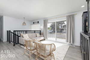 Living room with hardwood / wood-style flooring