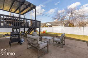 View of patio / terrace with a playground, a grill, a wooden deck, and an outdoor hangout area