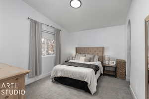 Carpeted bedroom with vaulted ceiling