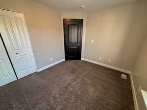 Bedroom with carpet floors and a closet