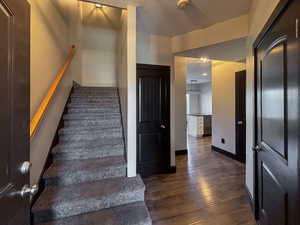 Entry featuring LVP / wood-style flooring and a textured ceiling