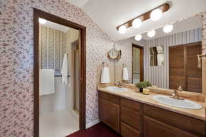 Double sinks, shower and toilet off main suite.