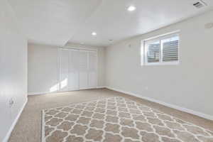 Unfurnished bedroom with carpet and a closet