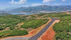 Property view of mountains with a water view