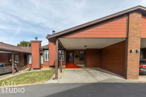 View of front of property featuring a carport