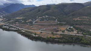 Property view of mountains with a water view