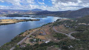 Aerial view featuring a water and mountain view