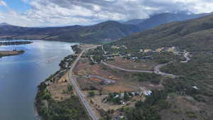 Aerial view featuring a water and mountain view