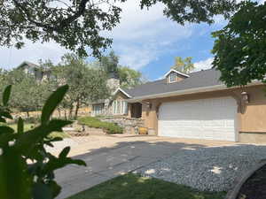 View of front facade featuring a garage