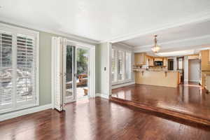 Sunroom leading to semi-formal dining area and kitchen