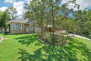 View of front of property with a front lawn and a garage