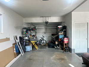 Garage featuring a garage door opener