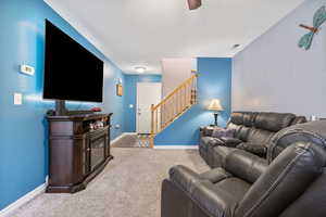 Carpeted living room featuring a textured ceiling