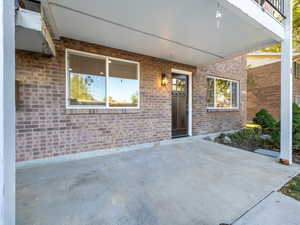 Property entrance featuring a patio