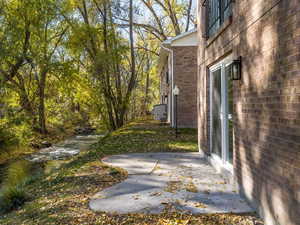 View of yard featuring a patio and a water view