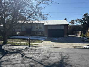 View of front of property with a garage