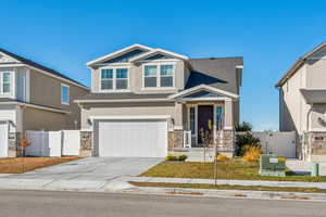 Craftsman-style home featuring a garage