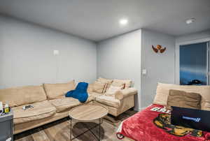 Living room with hardwood / wood-style flooring