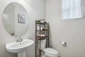 Bathroom with sink and toilet