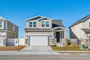 Craftsman house with a garage and cooling unit