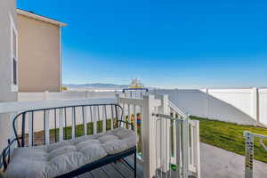 Wooden terrace with a yard and a mountain view