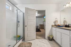 Bathroom with walk in shower and vanity