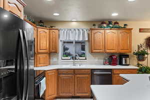 Kitchen with appliances with stainless steel finishes and sink