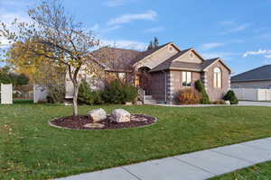 View of front of property with a front yard