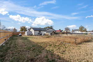 View of yard with a storage shed