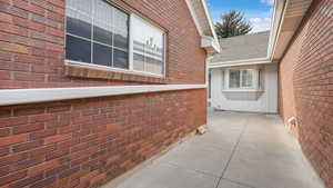 View of side of property featuring a patio area