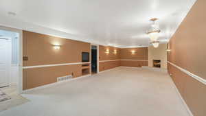 Interior space with a fireplace and ornamental molding