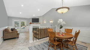 Dining room featuring lofted ceiling