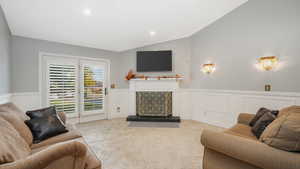 Tiled living room with lofted ceiling